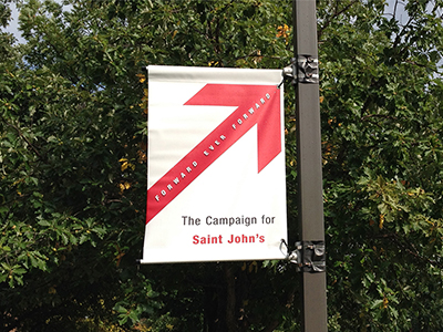 Photo of a Forward Ever Forward banner on campus