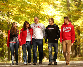 Photo of family walking through the woods at SJU