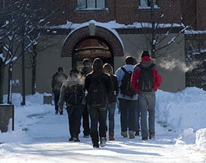 Photo of Johnnies walking in the snow to the Refectory