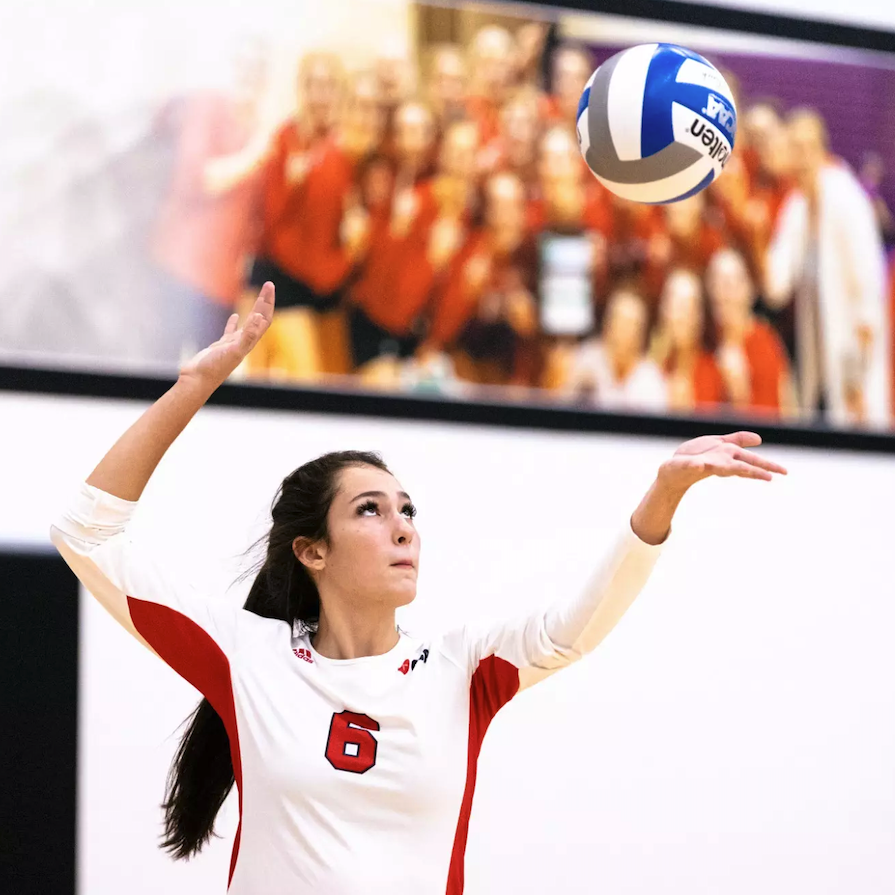 Audrey Spolidoro serving the ball
