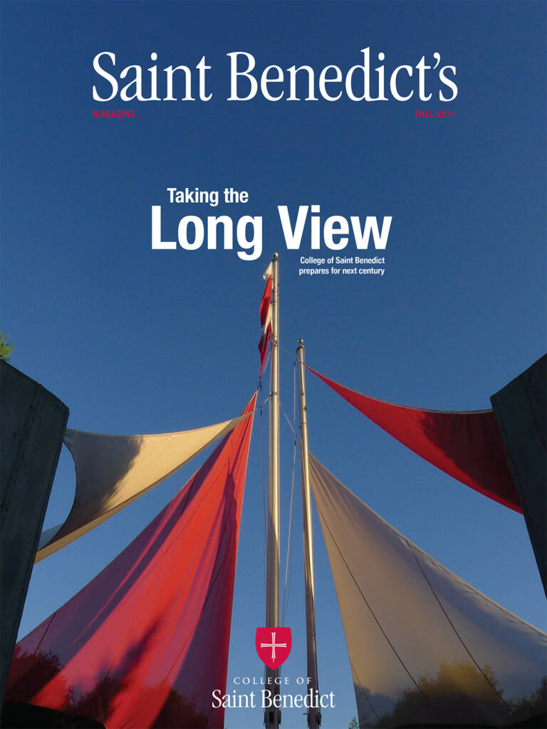 A magazine cover titled "Saint Benedict's" features an image of red and white fabric artfully stretched between poles against a clear blue sky. The text reads, “Taking the Long View.” It's the Fall 2013 edition, showcasing the College of Saint Benedict.