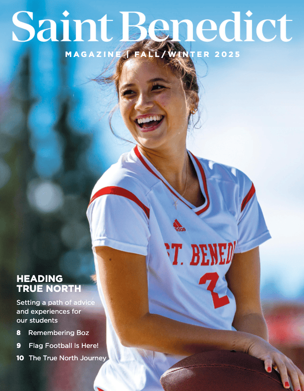 A young woman in a red and white "St. Benedict" football jersey smiles and holds a football on a sunny day. Magazine text headlines appear around her, including "Heading True North" and "Flag Football Is Here!.