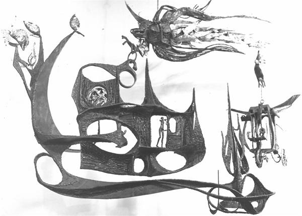 Abstract metal sculpture featuring curved, sweeping shapes, figures, and fantastical elements including animals and human forms interacting with the structure, set against a plain background.