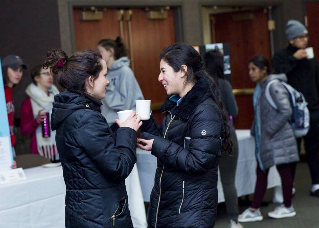 two-students-chatting-at-an-expo-event.