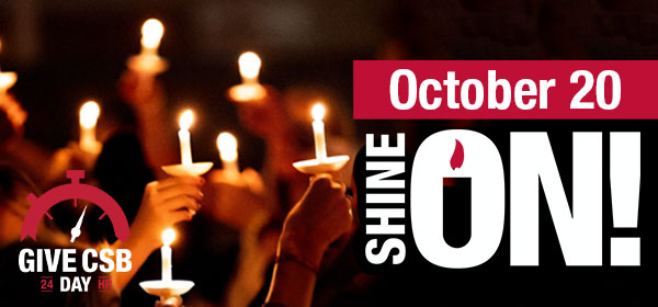 Illuminated candles; text October 20 Give CSB Day 