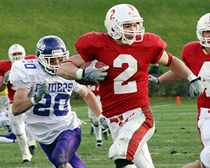 Photo of Blake Elliot '03 running with the football