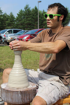 Photo of Joel Cherrico doing ceramics at SJU