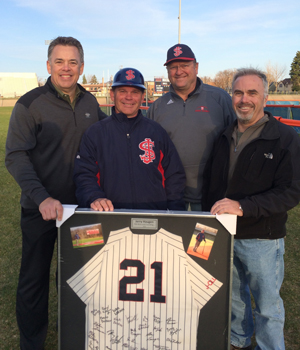 Photo of Jerry Haugen with three of his former players after his 700th win