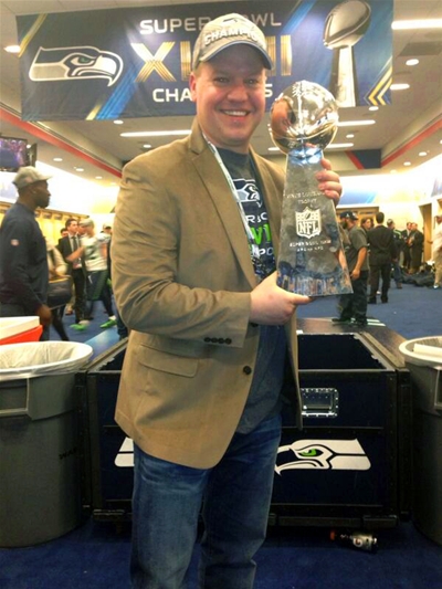 Photo of Trent Kirchner with the Lombardi Trophy