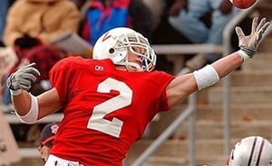 Photo of Blake Elliot catching a football during a game at SJU