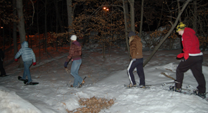 Photo of two students snowshoeing in the Saint John's Arboreteum