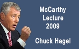 A man in a suit gestures with his hand while speaking. The dark blue background features the text "McCarthy Lecture 2009 Chuck Hagel" in white letters.