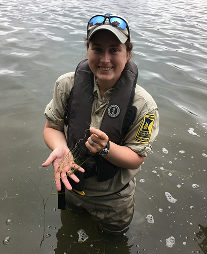 Courtney holding Widgeon Grass.