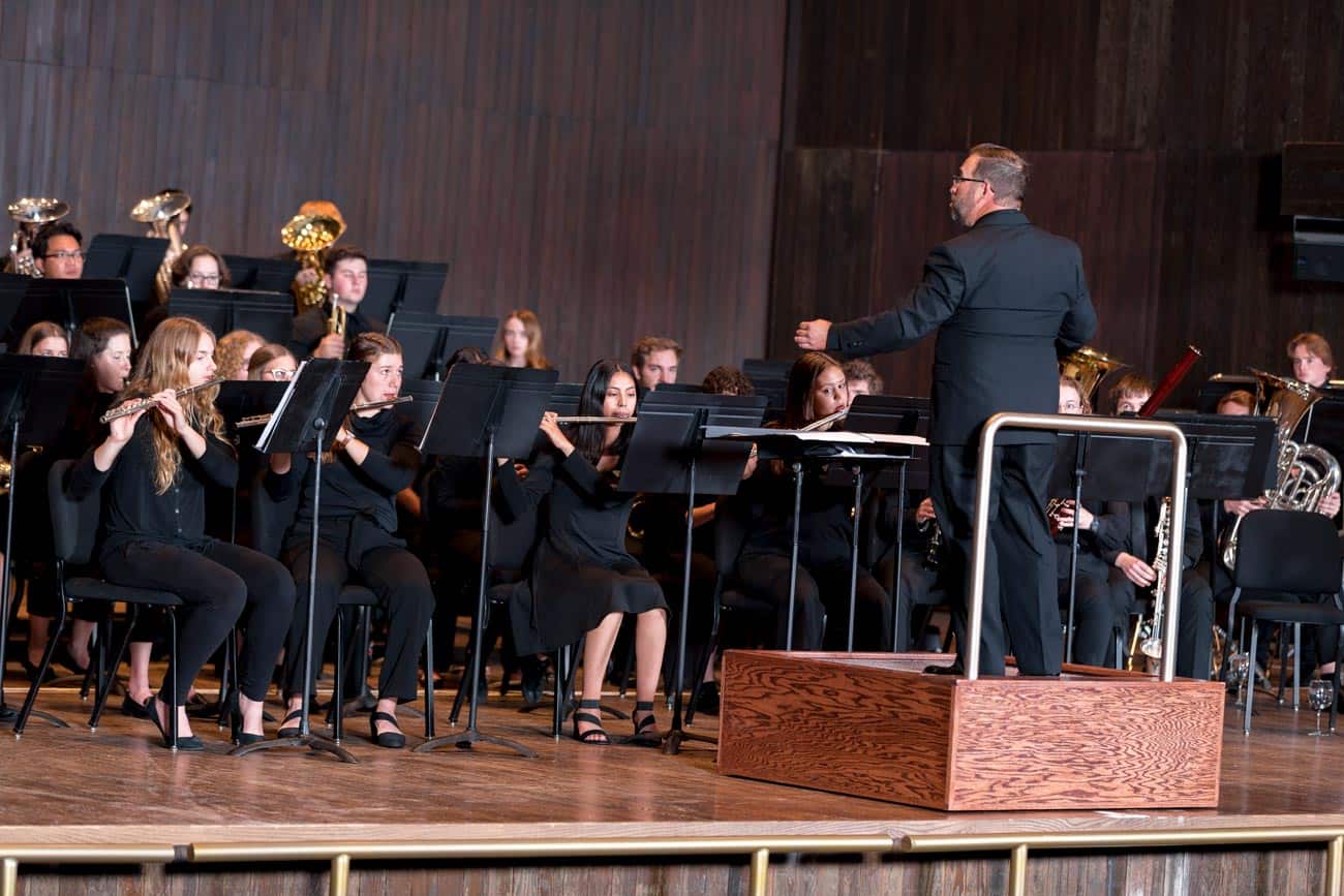 Justin Zanchuk directs the Wind Ensemble