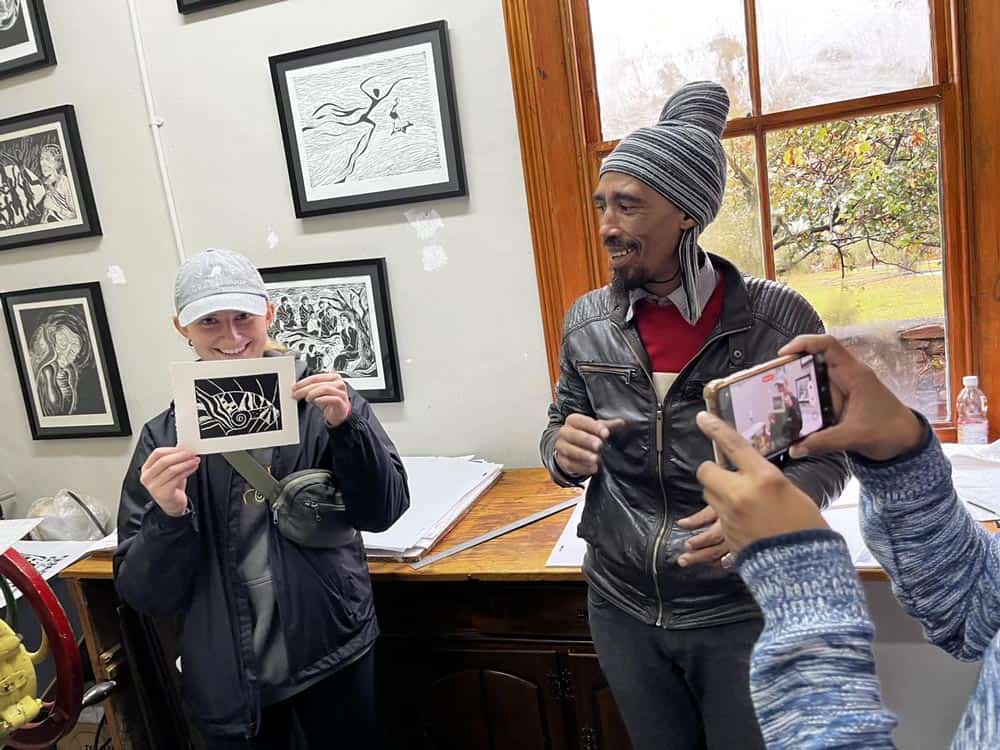 CSB student getting art instruction