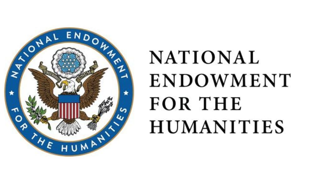 The image shows the seal of the National Endowment for the Humanities (NEH) on the left, featuring an eagle holding a shield and surrounded by stars. To the right are the words "National Endowment for the Humanities" in black, capitalized letters.