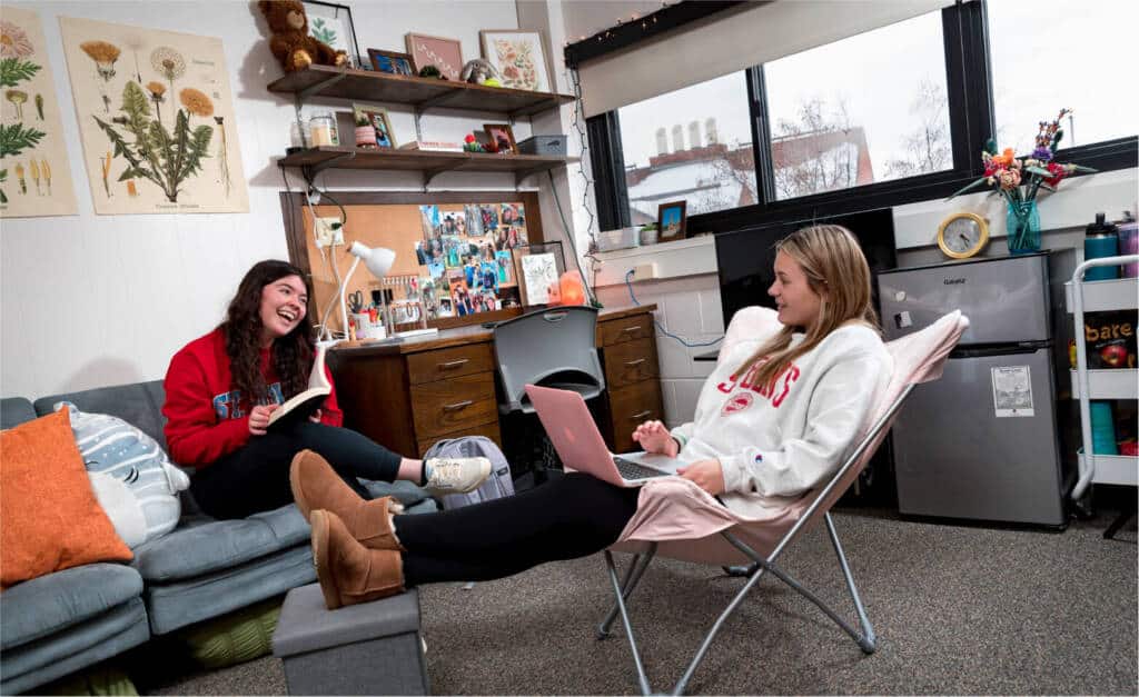 Bennies hanging out in dorm laughing and talking. 