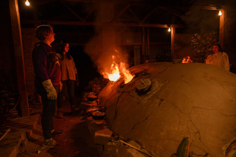 Students get hands-on experience during Sister Dennis Kiln firing